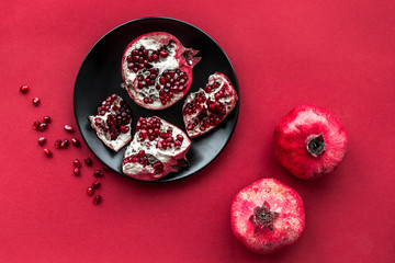 Fototapeta premium romantic dinner in red color with pomegranate top view