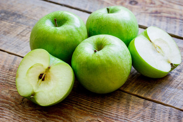green apples for healthy dessert on wooden background