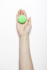 woman hand hold a fluorescence green ball isolated white, background.