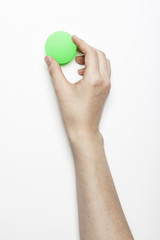 Fototapeta na wymiar woman hand hold a fluorescence green ball isolated white, background.