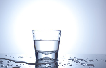 glass with drops on blue background