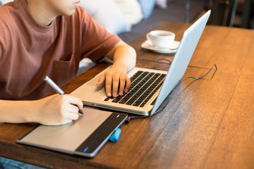 Student graphic design hand drawing on pen mouse pad