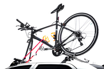 Bicycles on the top of car roof isolated