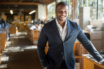 Handsome attractive african american modern professional smile standing confidently at the large interior workspace - 148629250
