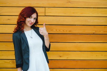 The girl shows the class sign