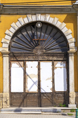 Old obsolete arch wooden door