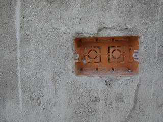 Orange Socket box nstallation on the wall
