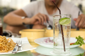 Man having glass of fresh sparkling mineral water