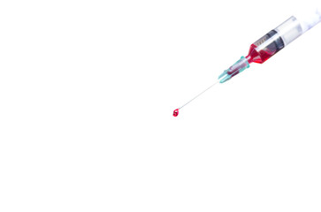 Conceptual drop of red liquid on the needle of a syringe isolated