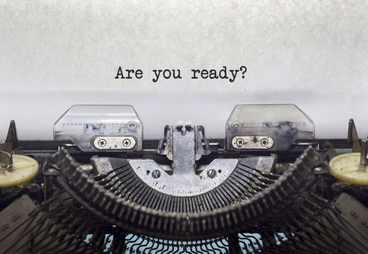 Vintage typewriter on white background with text Are you ready?