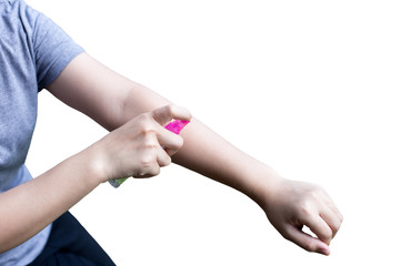 Woman spraying insect repellent on her hand isolated