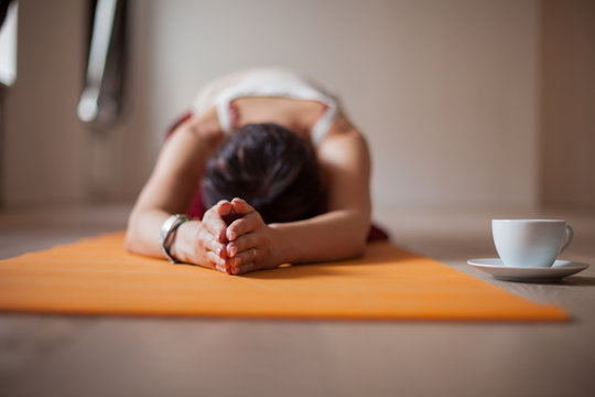 Young woman practicing yoga pose