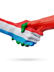 Flags Luxembourg, Portugal countries, partnership friendship handshake concept.