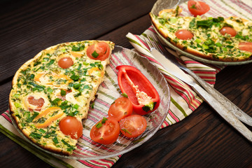 Omelette with herbs, tomatoes and sweet pepper 