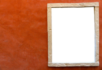isolated window frame in side of orange clay wall