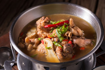 Chicken and herb soup in pot