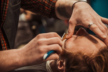 Hipster shears a beard