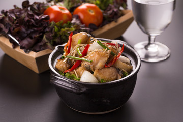 Piece of fried King Mackerel fish with fish sauce, served with spicy seafood sauce, thai style