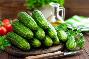Fresh cucumbers on wooden table