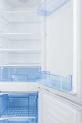 White refrigerator isolated on white background