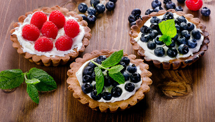 Tarts with fresh raspberries and blueberries