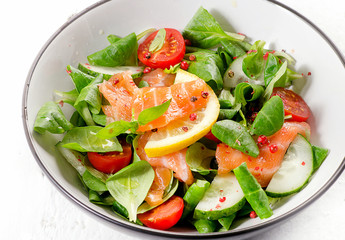 Fresh Salmon Salad. Healthy eating concept.