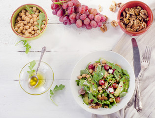 Fresh salad with chickpea, grape, walnut  and avocado. Healthy eating.