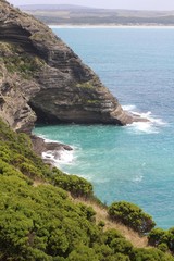 Coastal cliffs surrounded by turquoise water at Cape Bridgewater, Victoria, Australia