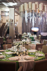 Cosy chairs stand at dinner table in the restaurant