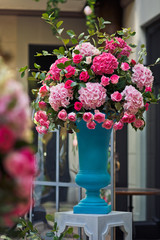Large blue vase with beautiful pink hydrangeas