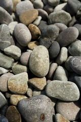 Fototapeta na wymiar Nature background of gray sea pebbles, pebble for garden decor