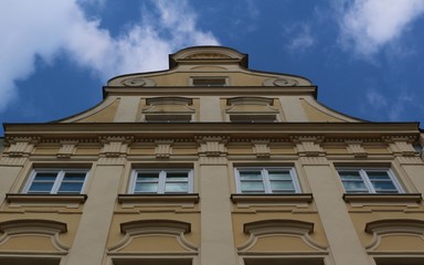 View towards the top of a yellow magnificent historical building in the Maximilian street in Augsburg, Germany