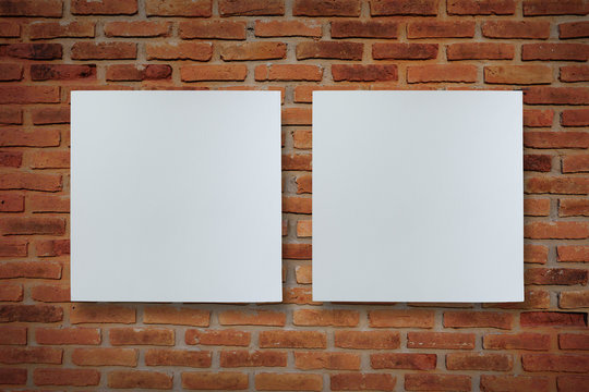 Two canvas frame on brick wall for image advertising.