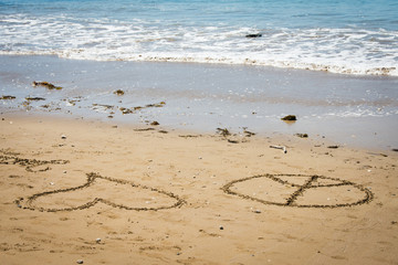 love and peace sign on beach