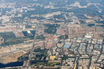 Top view of Residential area, Thailand suburb area. View from the window of an airplane