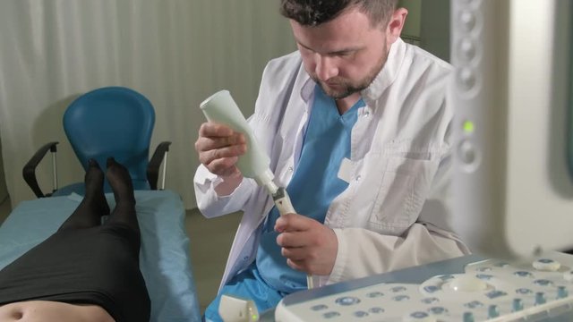 Doctor doing 3d ultrasound on belly of t woman in clinic 4k