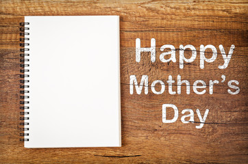 Happy mother's day with blank open sketchbook.