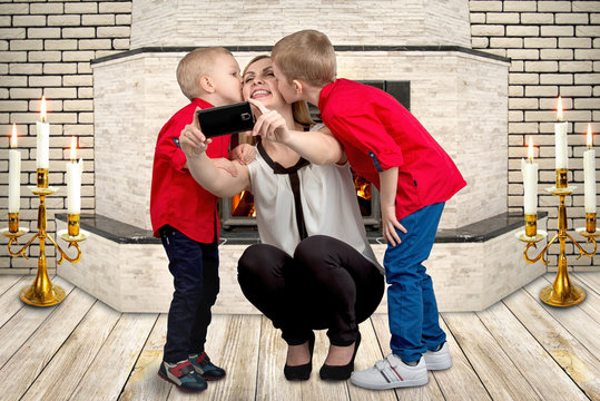 Two sons kissing their mother.Family selfie.Spring,women's day,mother's day.