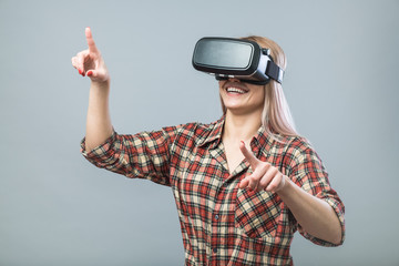 Cheerful woman with vr headset © Photocatcher