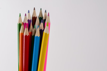 Multicolored pencils  on white background. Copy space