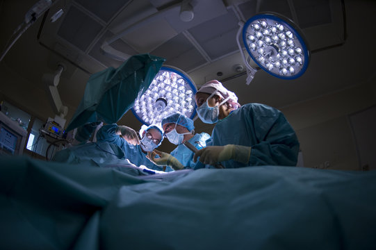 Surgeons doing an Achilles tendon surgery