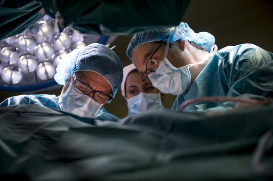 Close up of surgeons doing an achilles tendon surgery in hospital