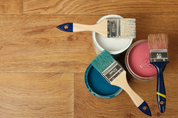 Three jars with paint and tassels