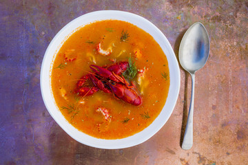 Crayfish soup on a vintage background.