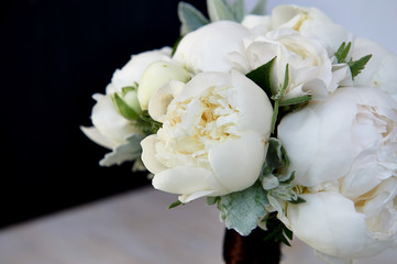 Obraz na płótnie Canvas Wedding bouquet of white peonies and ranunculuses.Wedding floristry
