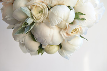 Obraz na płótnie Canvas Wedding bouquet of white peonies and ranunculuses.Wedding floristry