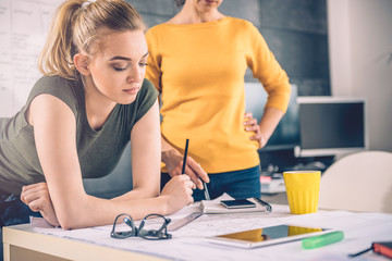 Two business woman contemplating
