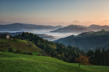 Slovenia, Morning landscape with fog in the mountains