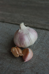 Fresh young garlic from a home garden on wooden boards.