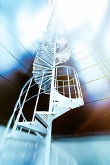 Industrial zone, Steel stairs in blue tones. toned image. Motion blur effect.